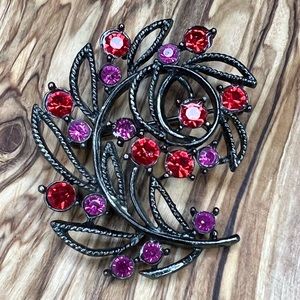 Beautiful, black, red and fuchsia brooch leaf design